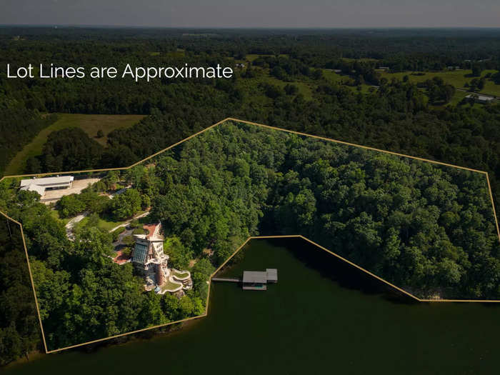 The property, which was built into a cliff 400 feet above the water in 1980, sits on 6 private acres behind a gated driveway.