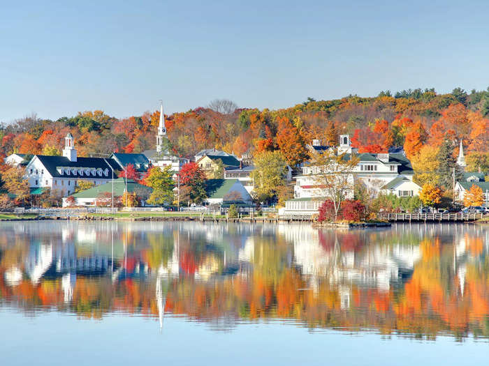 Fall scenery is reflected in Lake Winnipesaukee in Meredith, New Hampshire.