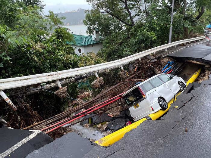 The deluge destroyed part of a road, as seen in this photo taken on Friday.