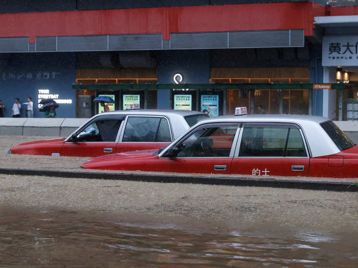 Cars across the urban sprawl were submerged in murky water.