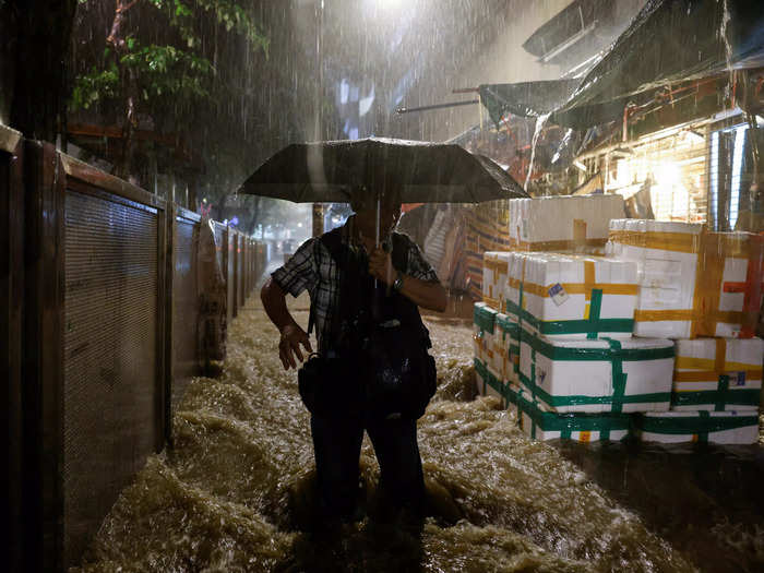 Muddy floodwaters surged into the city