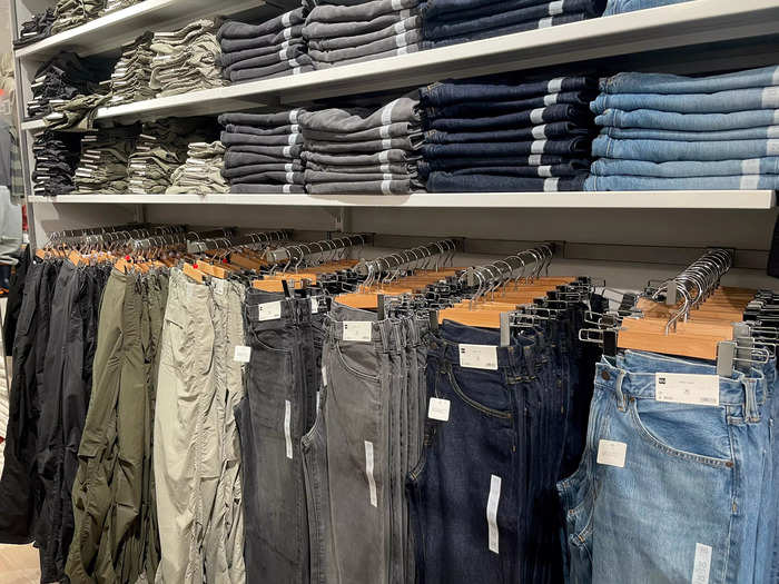 There were several pairs of jeans and cargo pants for men.