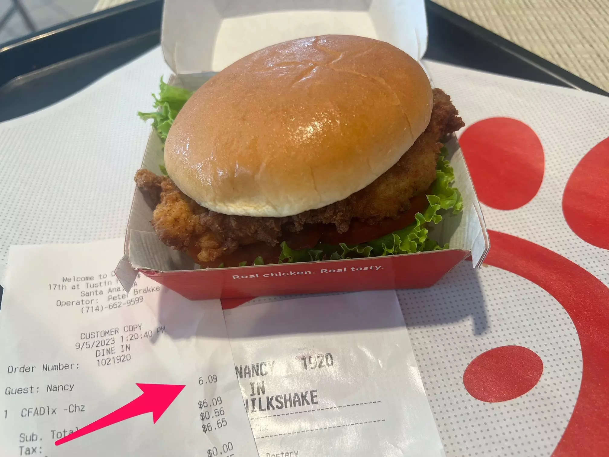 Chick-fil-A Sandwich with receipt with tomatoes and lettuce