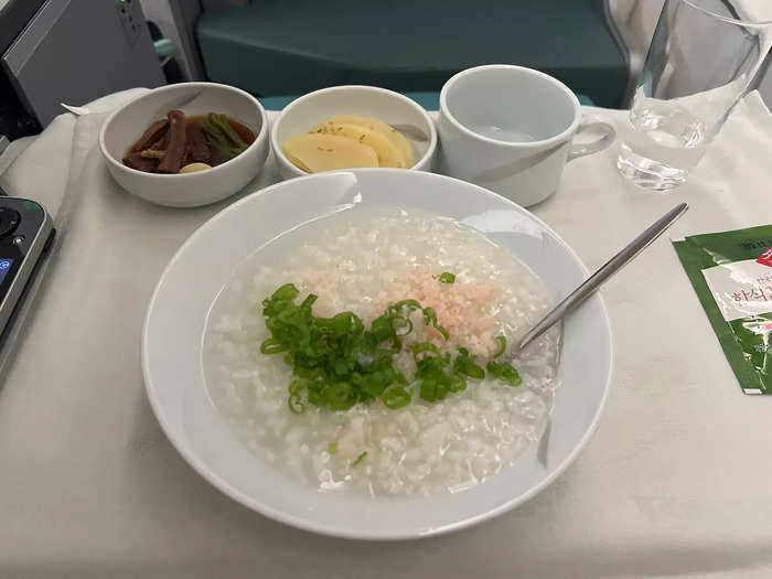 About three hours from landing the flight attendants woke the cabin up for the second meal service, and I opted for the Korean-style porridge.