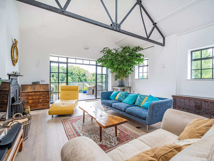 The open-plan living room and dining room were converted from five rooms.