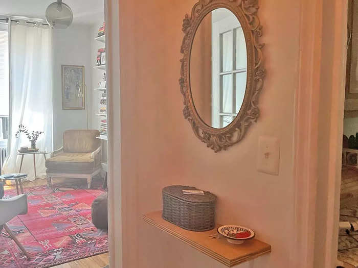 A larger mirror would open up the foyer area.