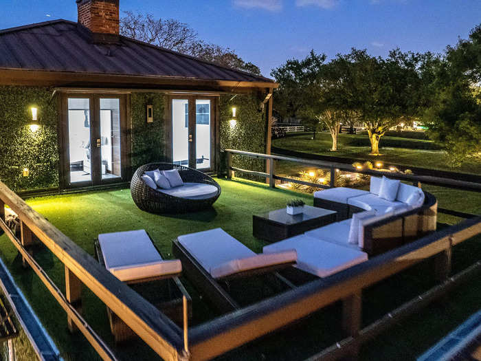 A room on the second floor leads to a rooftop deck with a view of the property