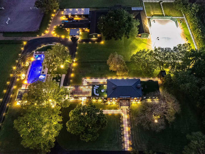 This is an aerial view of the property, which sits on 7.5 acres of land. You can see the tennis courts in the top-right corner and part of the equestrian rink in the top left.