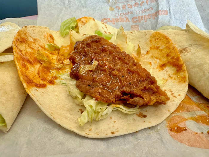 Each wrap had a piece of fried chicken that looked like it had been smashed and cut in half.