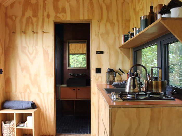 The kitchen was also fully stocked with essential cooking items, including a gas stove, a sink with running water, knives, olive oil, seasonings, coffee beans, a grinder, and a French press.