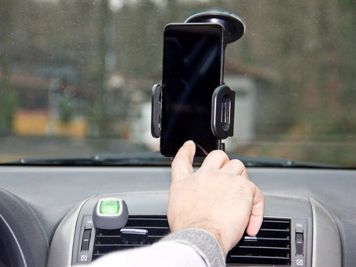 For nervous drivers on solo road trips, Noyen recommends investing in a car phone holder.