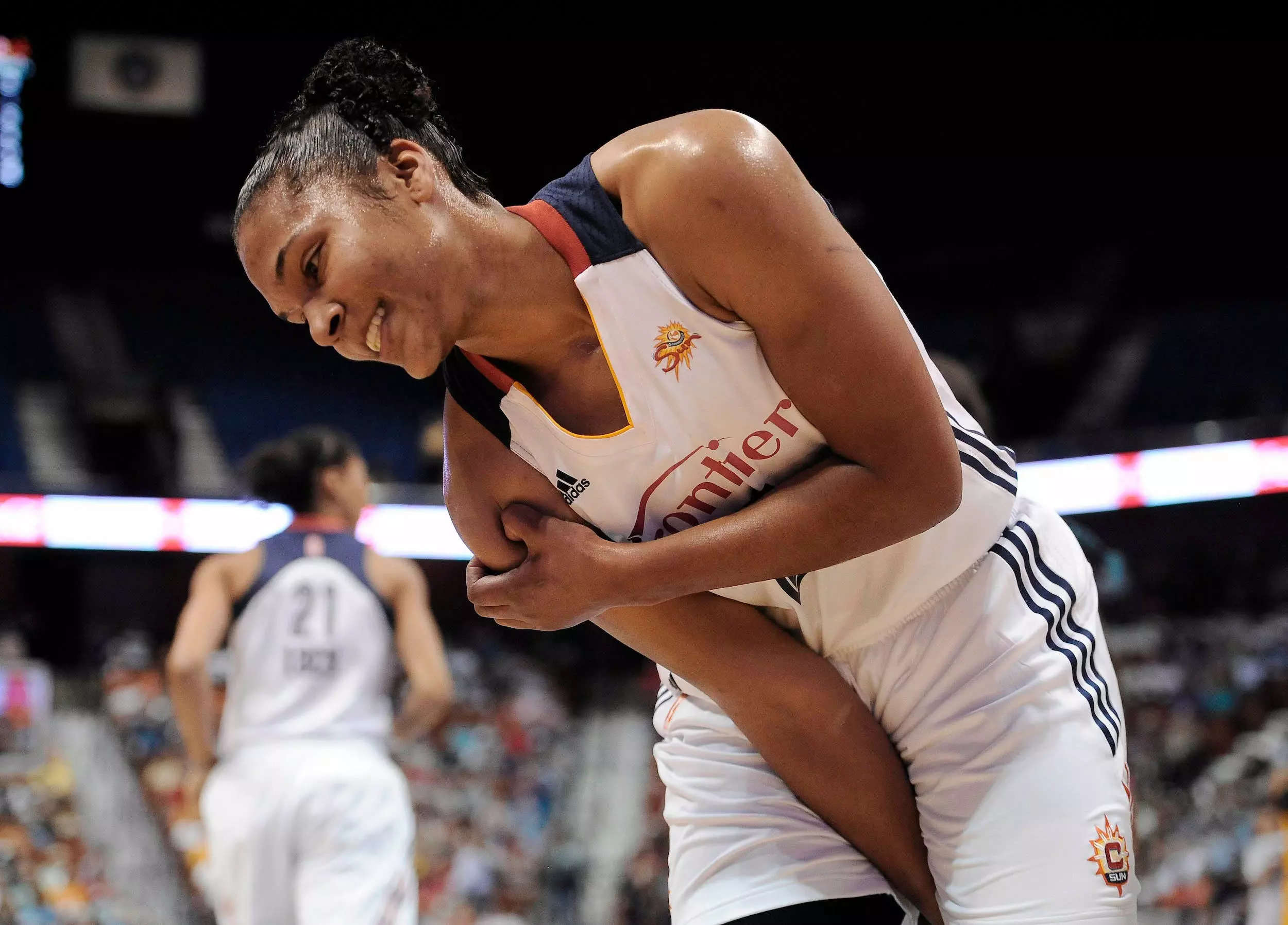 Alyssa Thomas clutches her right shoulder during a 2015 game.