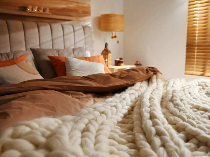 Switching up your fall decor with a wool throw blanket can add texture to your space.