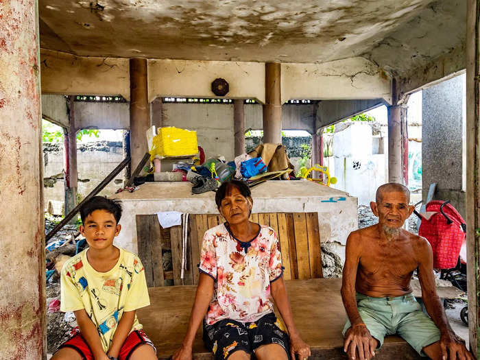 Elvera and Diktor Uliyamot were some of the first people to live in the cemetery. The couple have lived there for more than 40 years — right when the land was reclaimed from the ocean.