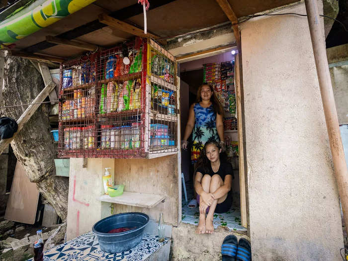 Roselyn and Rosemarie Aquino are sisters who have lived in a house made out of a mausoleum for 13 years. They sell snacks in their mini convenience store to make a living.