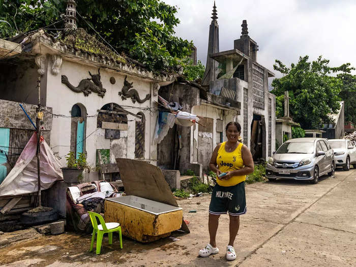 Merle Rabacal is a long-time resident of the Chinese Cemetery. She spends her day caring for her children, whom she lives with in a small mausoleum at the entrance of the graveyard.