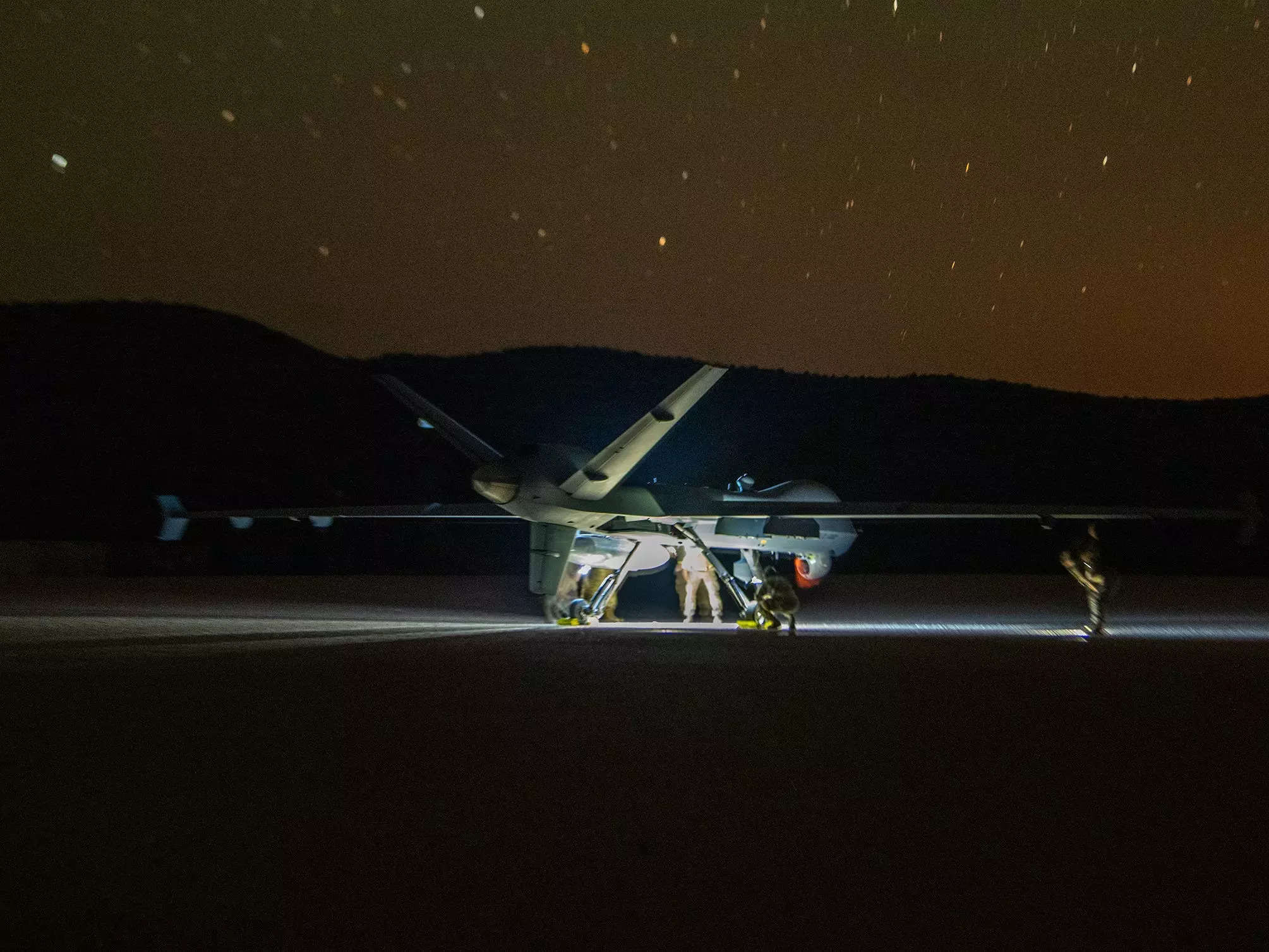 A US Air Force MQ-9 Reaper conducts the first ever MQ-9 Reaper landing on a dirt landing zone during a training exercise near Fort Stockton, Texas, June 15, 2023.