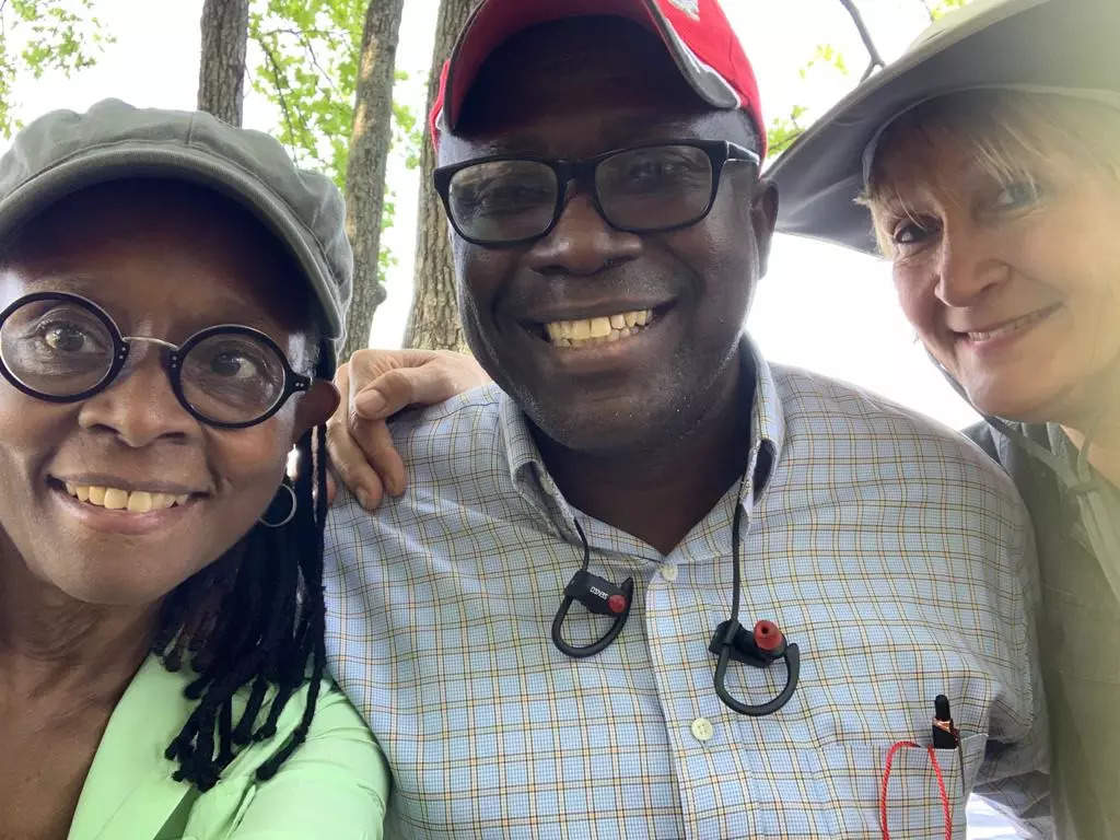 Konda Mason with rice businessman Robert Bimba and Jubilee Justice SRI advisor Erica Styger