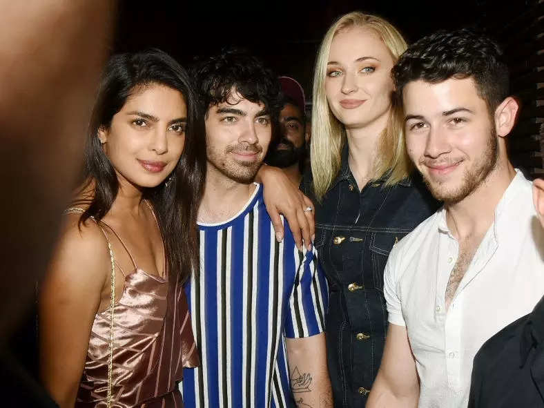 Priyanka, Joe, Sophie, and Nick photographed on a night out.
