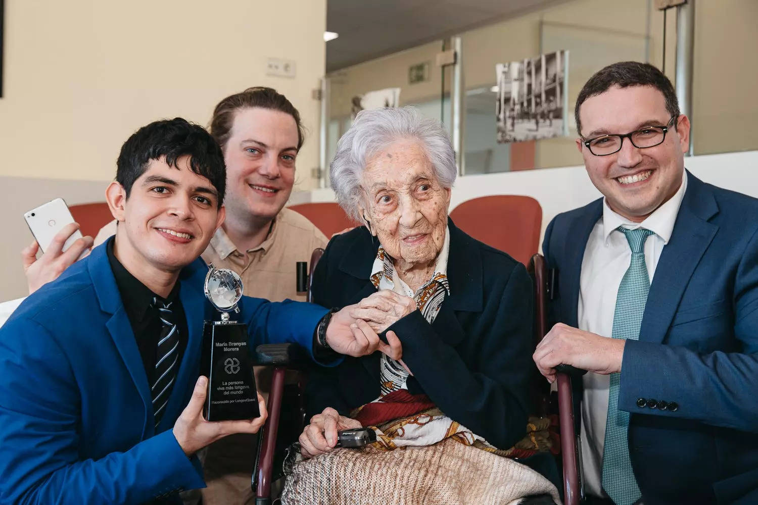 Fabrizio Villatoro and Ben Meyers with María Branyas Morera, the oldest living person in the world.