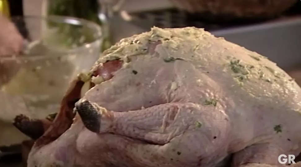 Screenshot of Gordon Ramsay covering turkey with butter in Thanksgiving YouTube video.