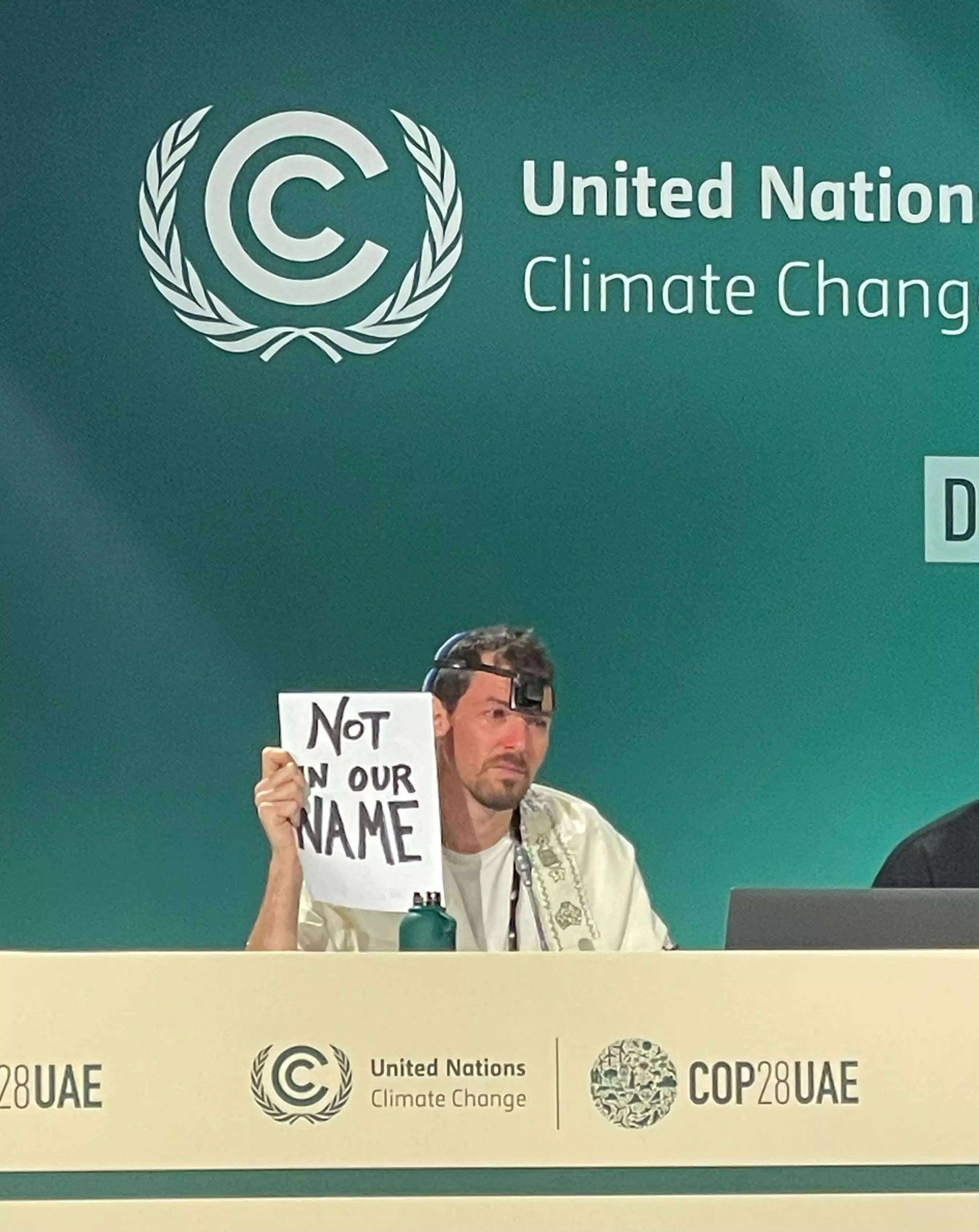 Kevin Buckland of the Artivist Network speaks at a press conference at the UN climate summit in Dubai.