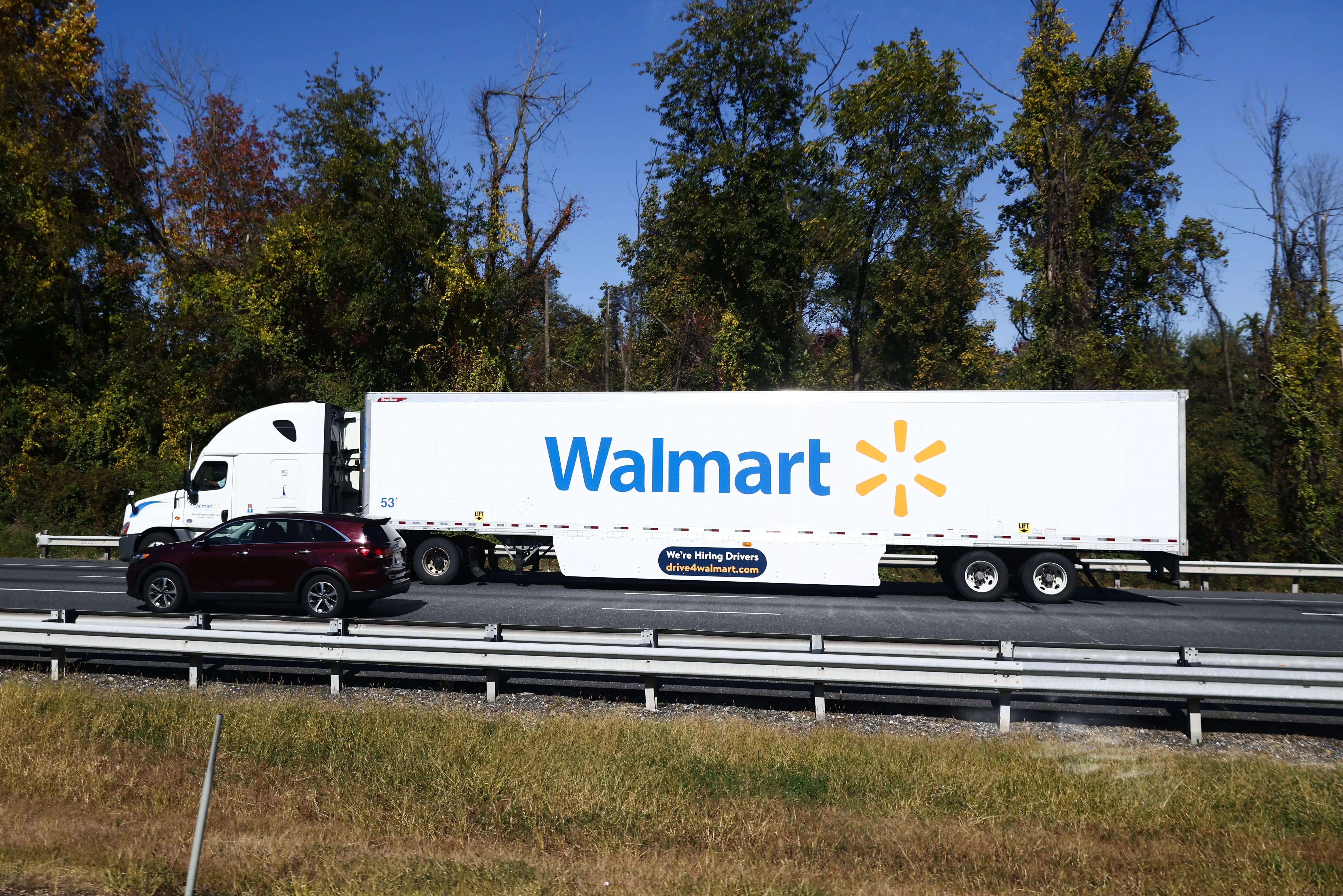 A Walmart 18-wheeler on a highway.