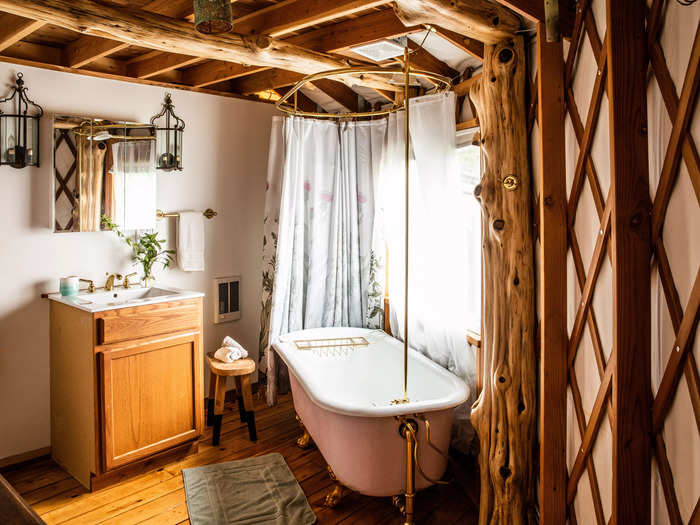 One of the standout features of the yurt is the antique tub, which sits beside a window providing sweeping views of the surrounding pastures.