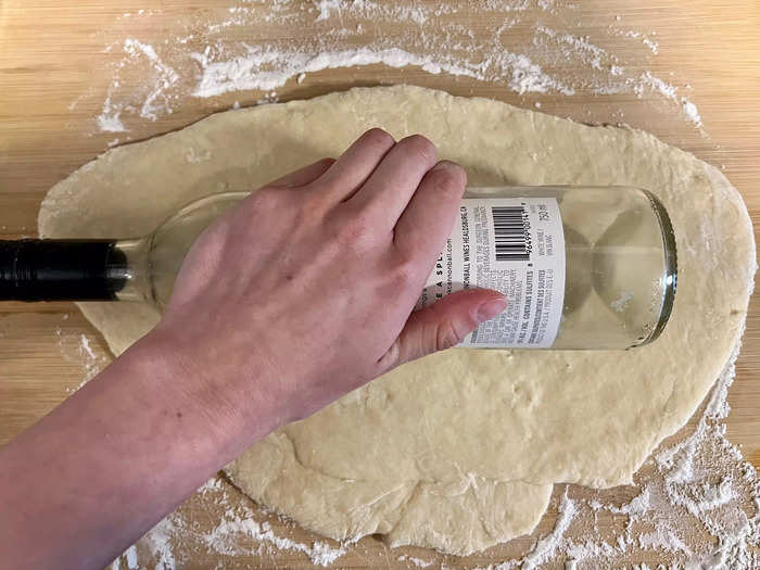 To flatten the dough, I used a wine bottle as a makeshift rolling pin. 