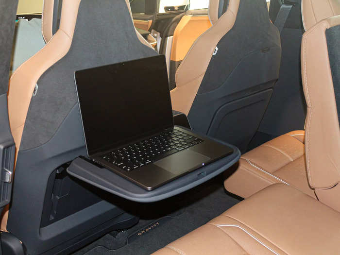 Tray tables in the second row make for a workspace on the go.