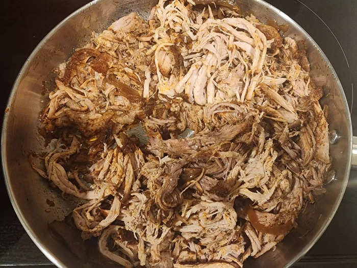 After the pork was done, I removed the fat, shredded the meat, and cooked it again with barbecue sauce.