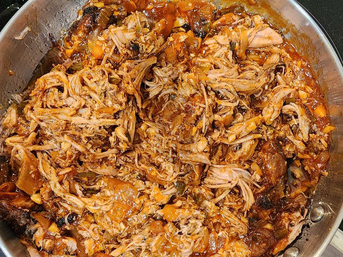 I began mixing the completed barbecue sauce with the pulled pork.