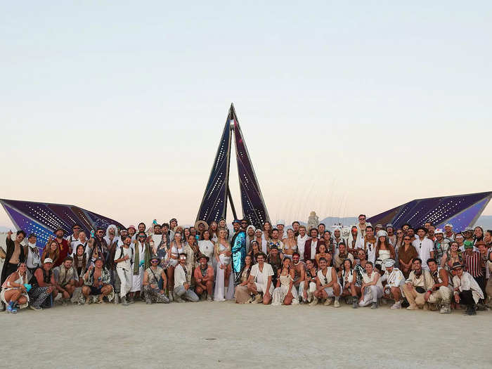 As the ceremony came to an end, the newlyweds shared hugs with their friends and headed back to camp for a Burning Man wedding reception.