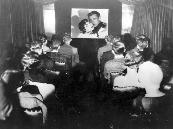 In transit, movies were projected onto the carriage wall in cozy theaters lined with curtains and rows of chairs.