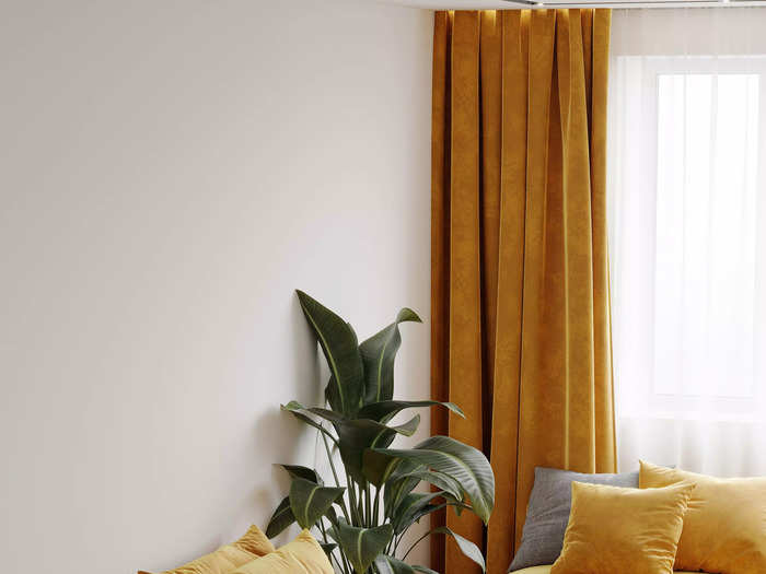 Hang curtains that go all the way to the ceiling.