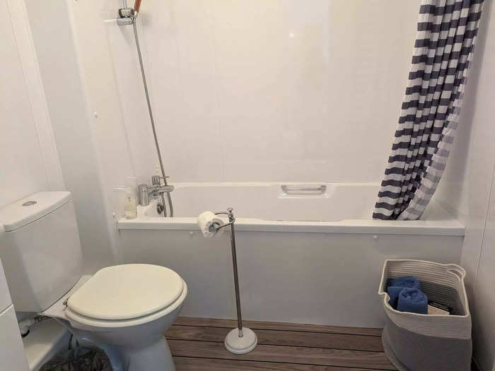 The bathroom was also sparse, with a standard bath and a shower.