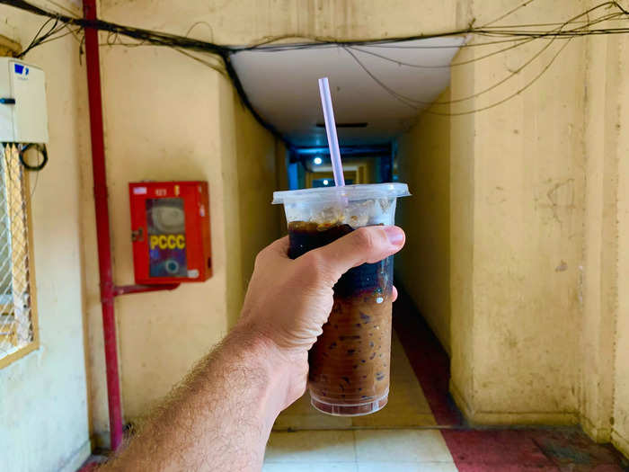 After breakfast, I picked up a takeout Vietnamese coffee from one of the makeshift cafes.