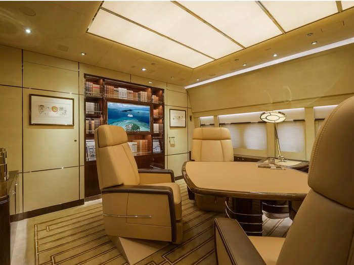 Private office spaces and dining areas complemented by recliner leather chairs and entertainment systems can be found in pockets throughout the cavernous aircraft.