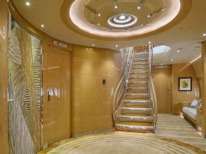 The main foyer of the aircraft divides the master bedroom from the rest of the aircraft and is home to the staircase leading to the upper deck.
