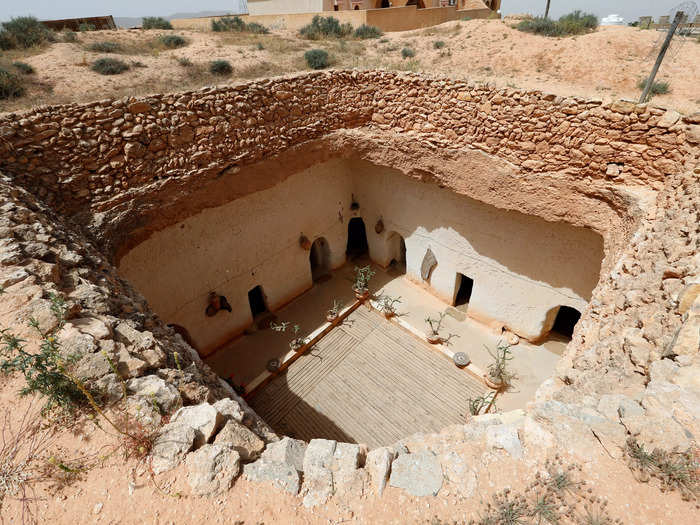 Cave homes in Gharyan, Libya, are dug vertically into the ground with a center courtyard.