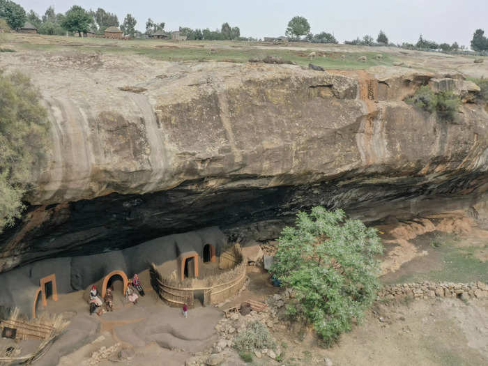 Local families of Lesotho, Southern Africa, still live in traditional mud dwellings known as the Kome Caves.