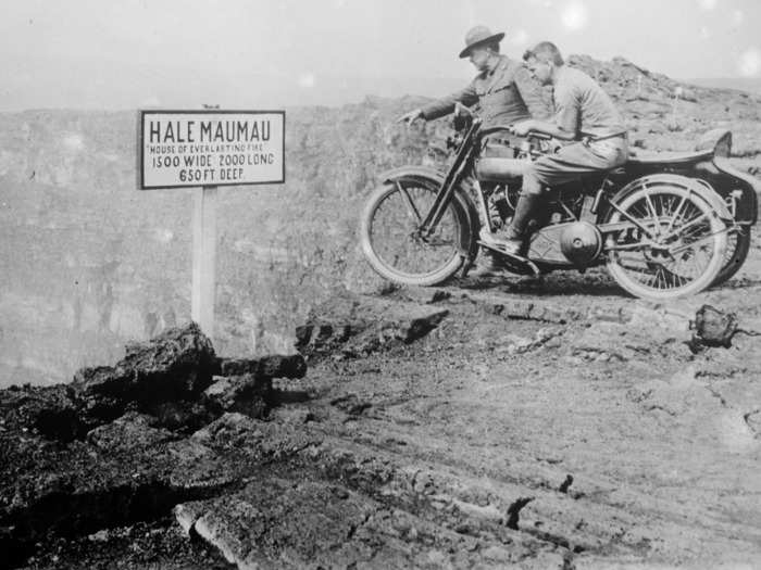 1930: Tourists peer into the mouth of Halemaumau or "House of Everlasting Fire," the inner crater of Kilauea, the most active volcano in the world at the time.