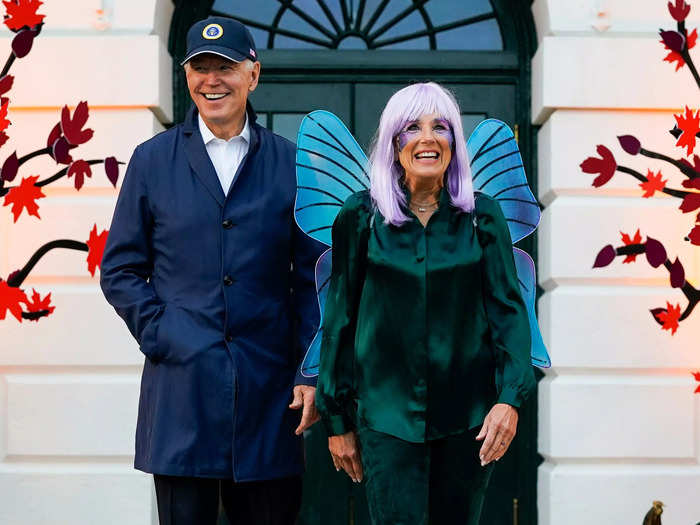 First lady Jill Biden wore butterfly wings and a purple wig with purple face paint to hand out candy to trick-or-treaters in 2022.