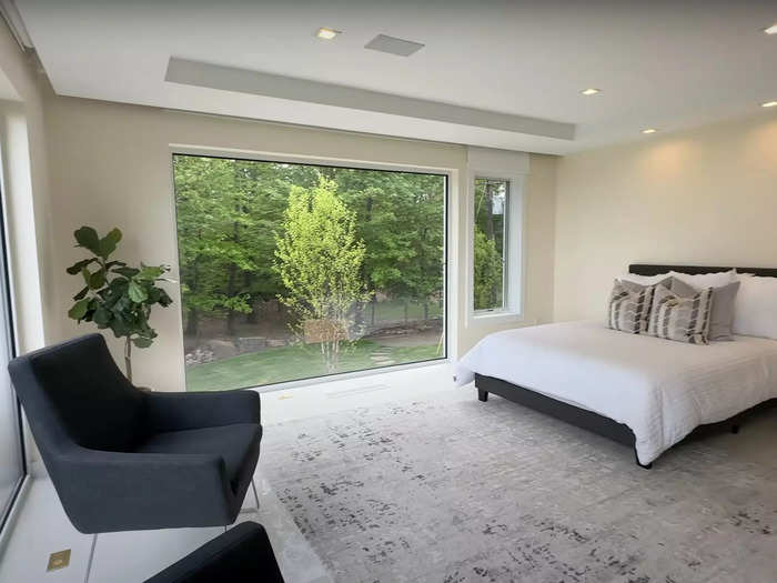 Down a hallway to the right is a first-floor guest suite full of natural light.