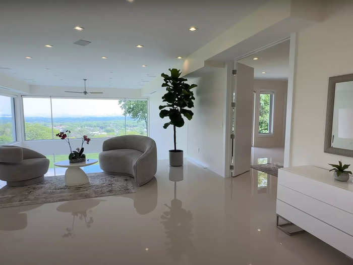 Yet another cushy lounge area with a stunning view awaits those who venture to the second floor of the home.