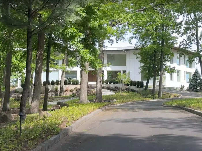 Set back from the street and behind a host of trees, the home is fairly private despite having huge windows throughout.