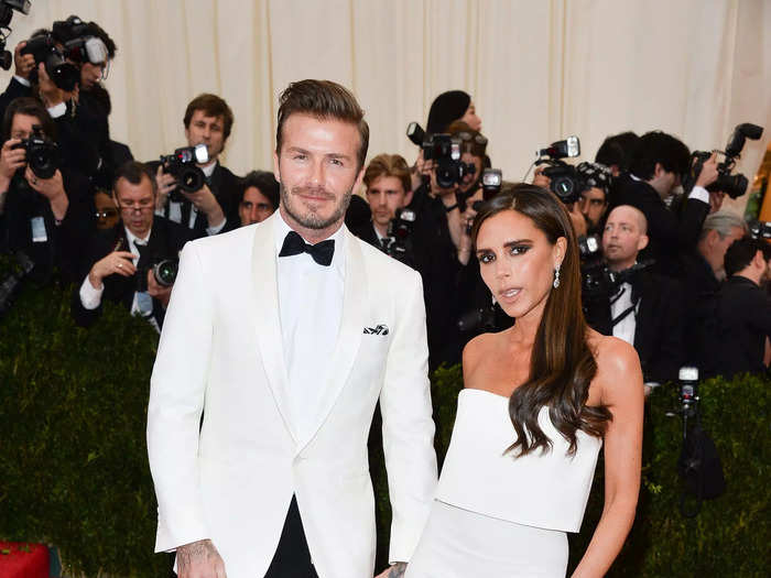 At the 2014 Met Gala, Victoria wore a strapless, floor-length white gown and David wore a matching blazer.