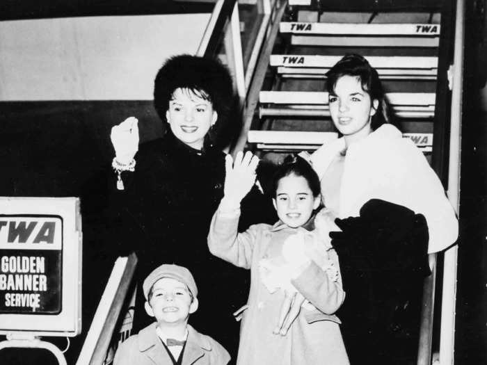 Judy Garland, opting again for a chic, all-black ensemble, was pictured with her children, Liza, Lorna, and Joe, in 1962.