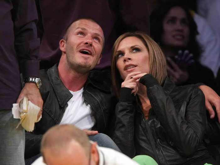 David looped an arm around Victoria as they watched an LA Lakers basketball game in 2008.