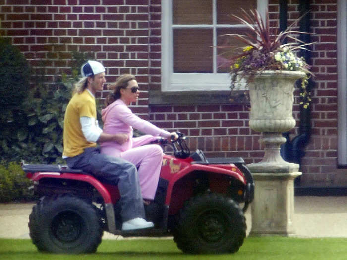 David and Victoria took a spin on a quad bike at their home in Hertfordshire in 2004.